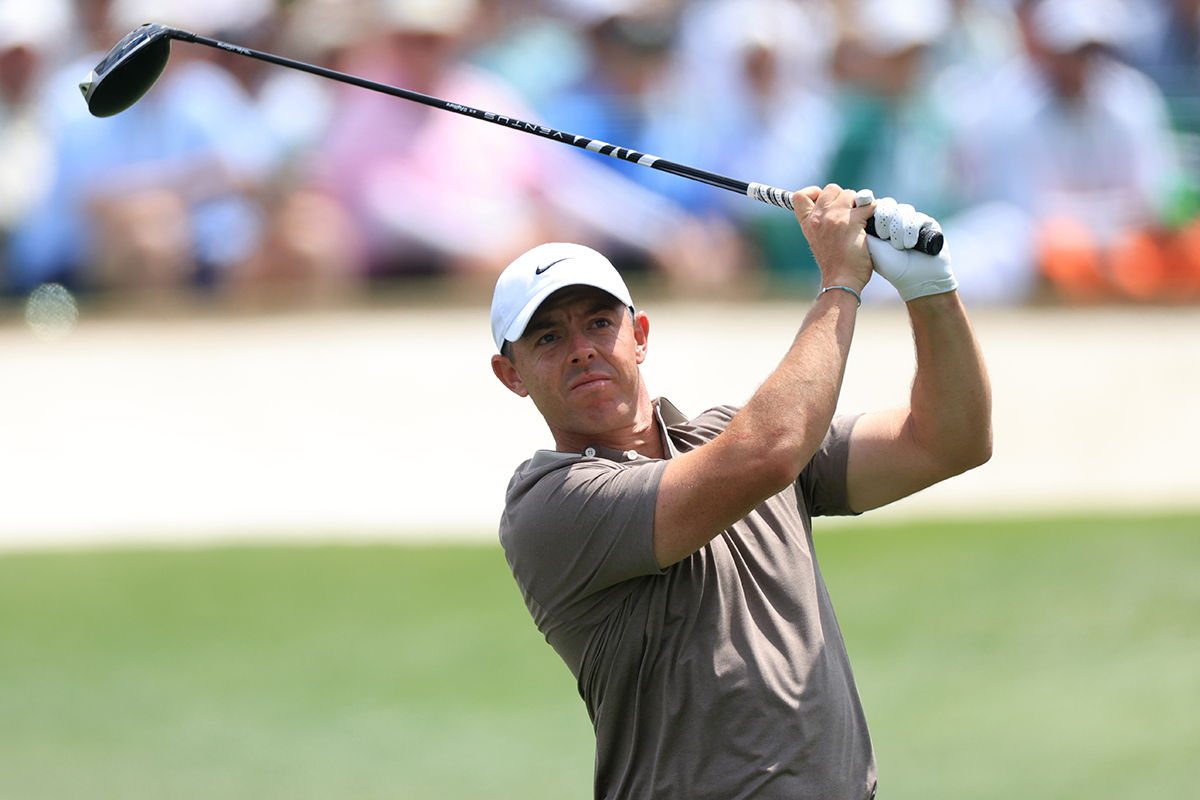 Rory McIlroy in the finish position with driver after hitting a tee shot at The Masters at Augusta National