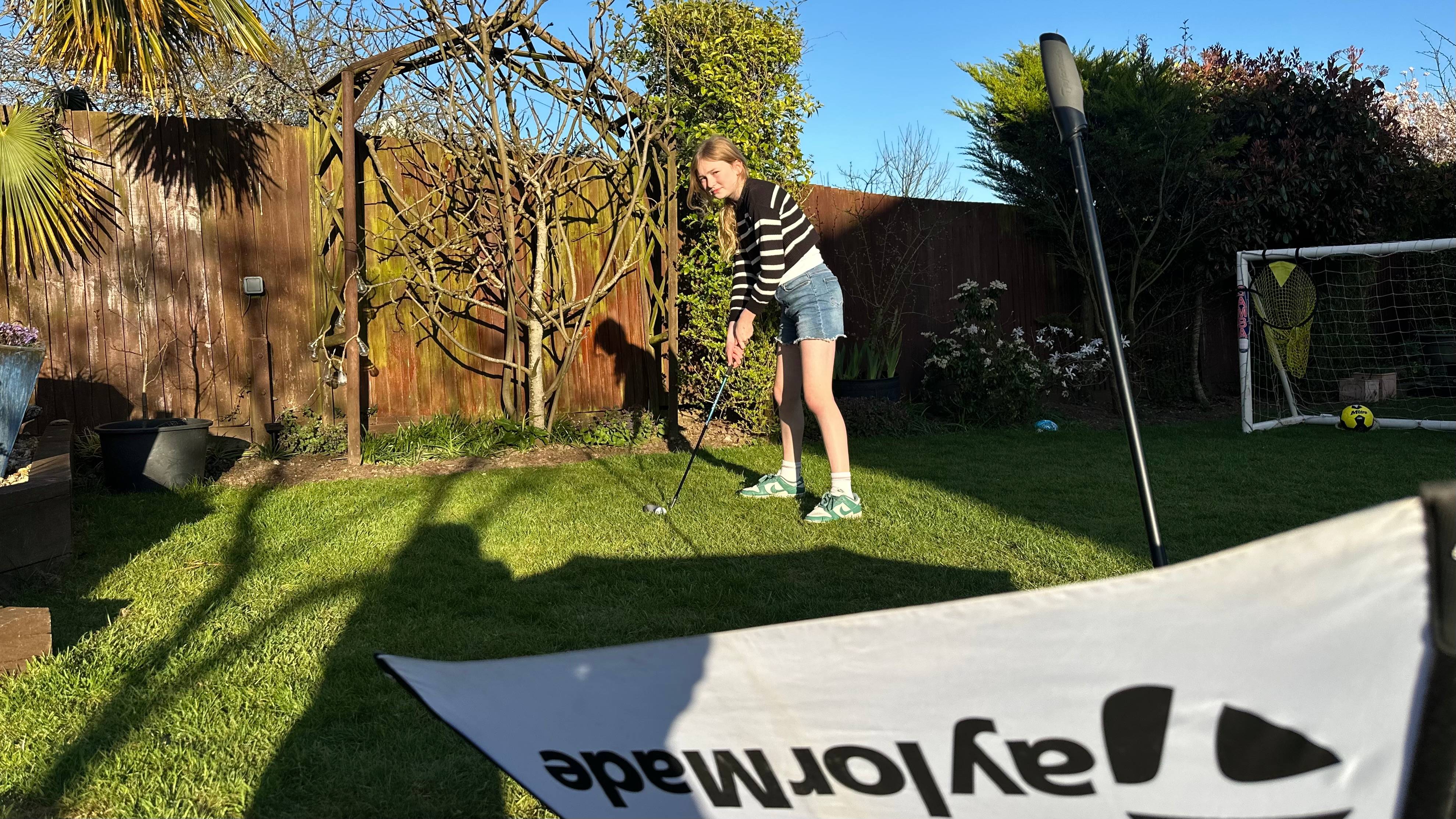 Katie Dawkins daughter Libby playing golf