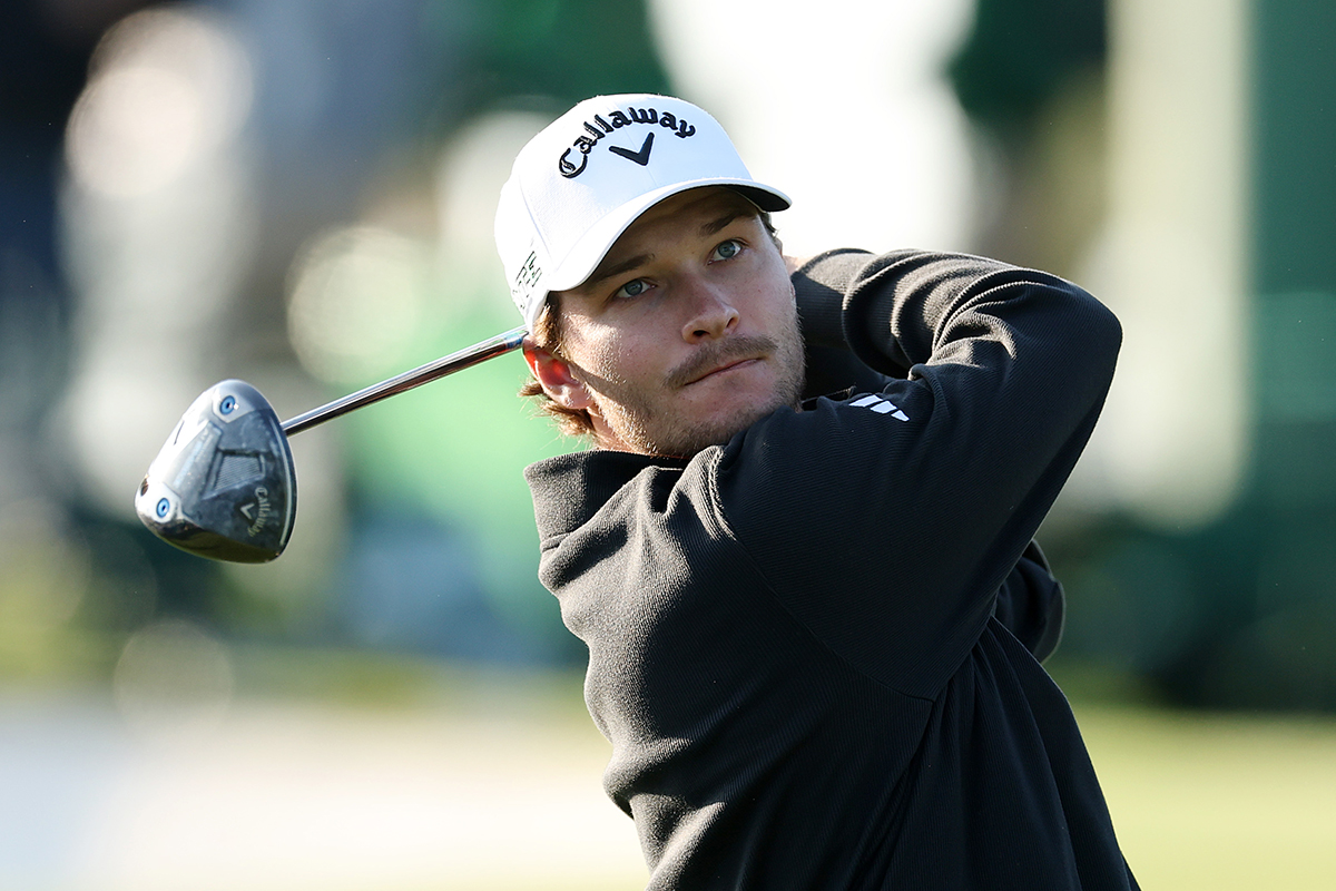 Rasmus Hojgaard in the finish position with driver while playing at The Masters at Augusta National