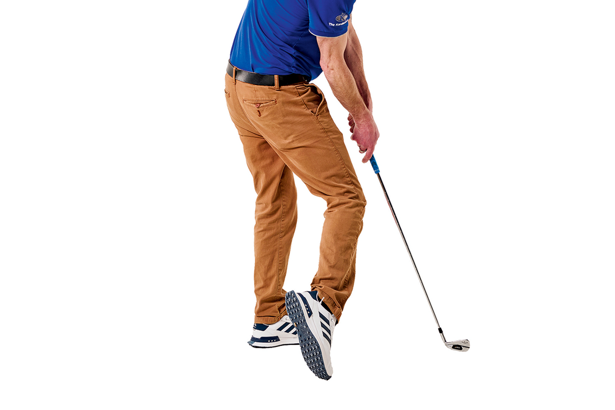 Tom Motley demonstrating a common golf swing fault that he calls 'Elvis leg', where the trail foot has come up onto the toes and the trail leg is bent at impact