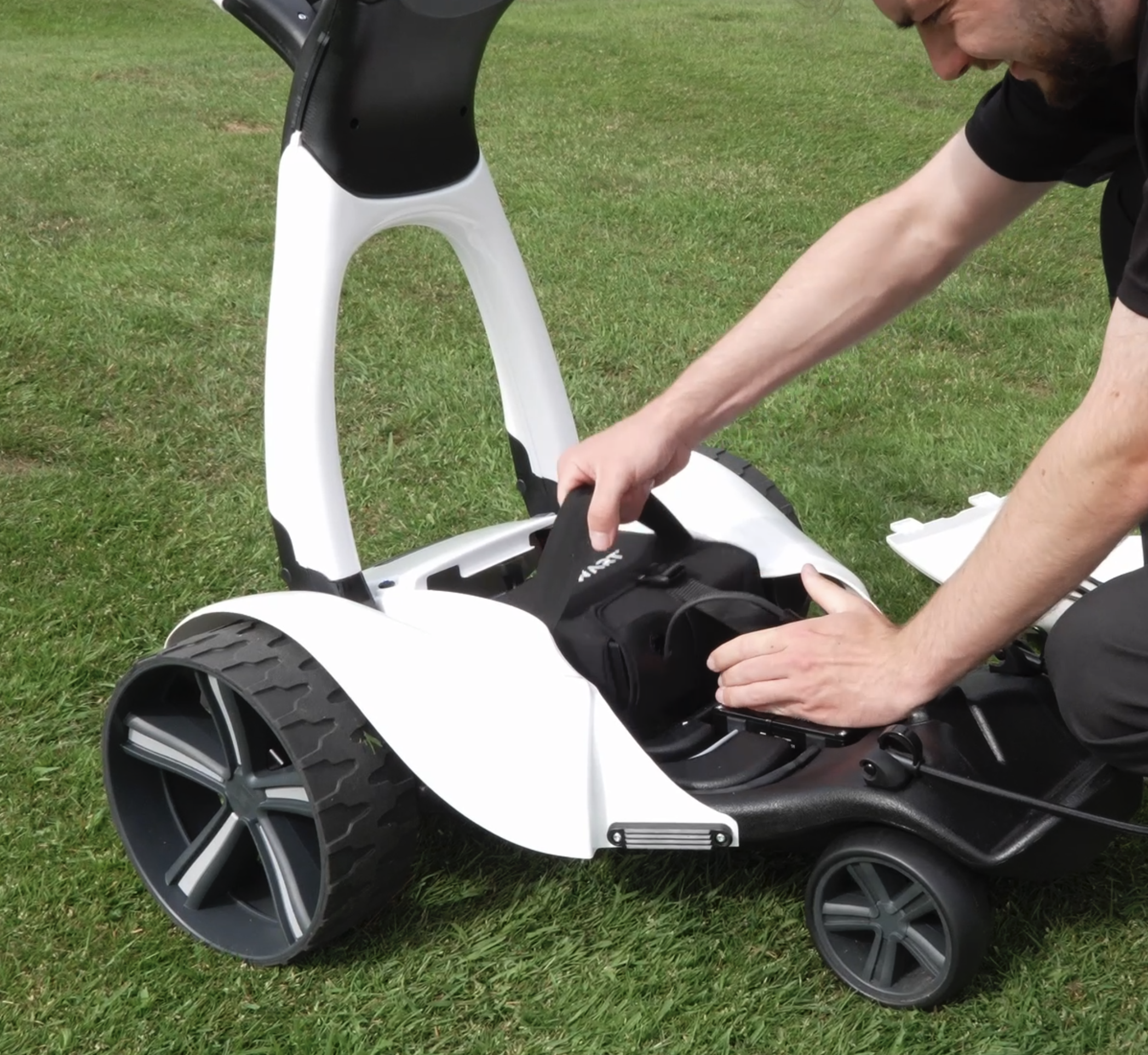 Battery being added to the Stewart Golf V10 Remote electric trolley