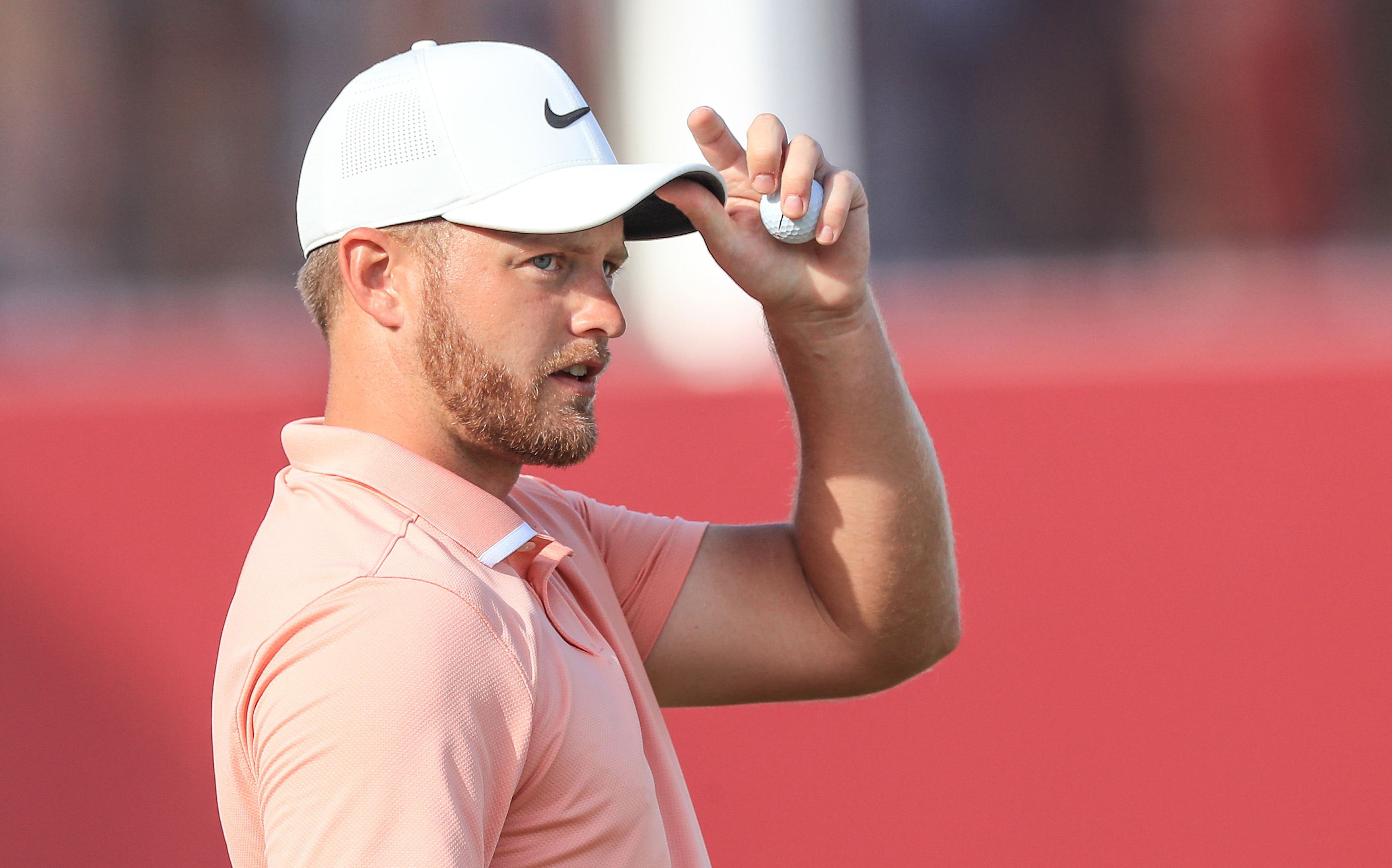 Tom Lewis touches his cap