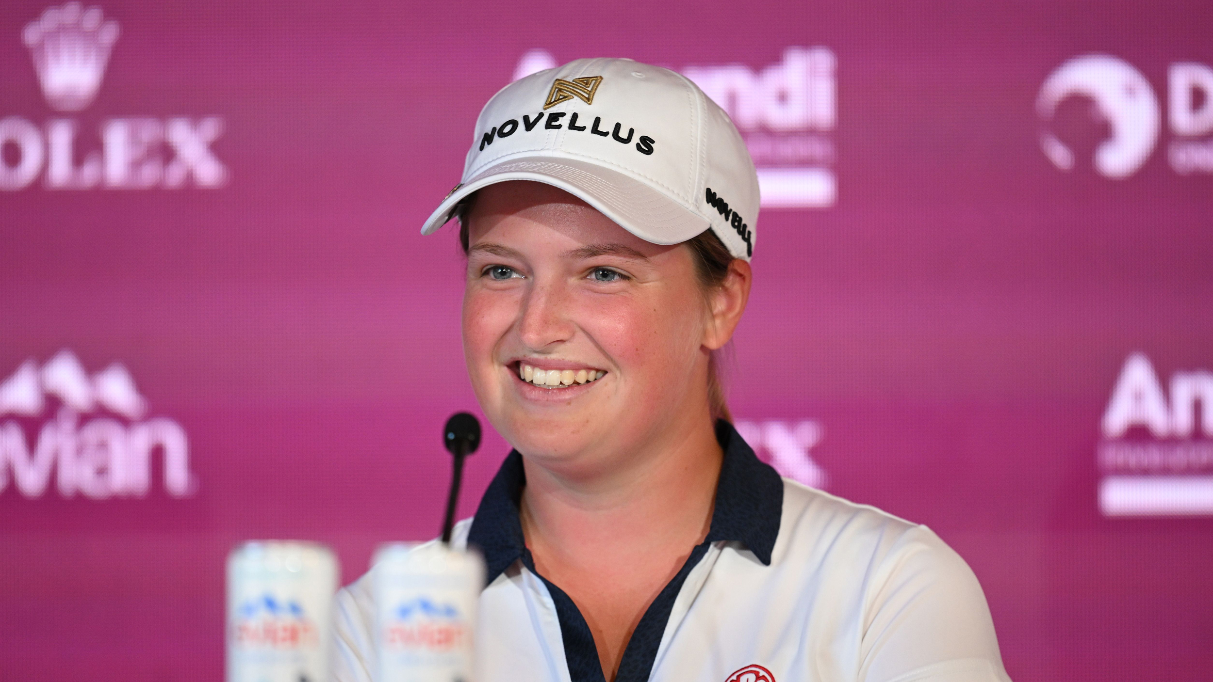 A headshot of Lottie Woad during her pre-Evian Championship press conference in 2025