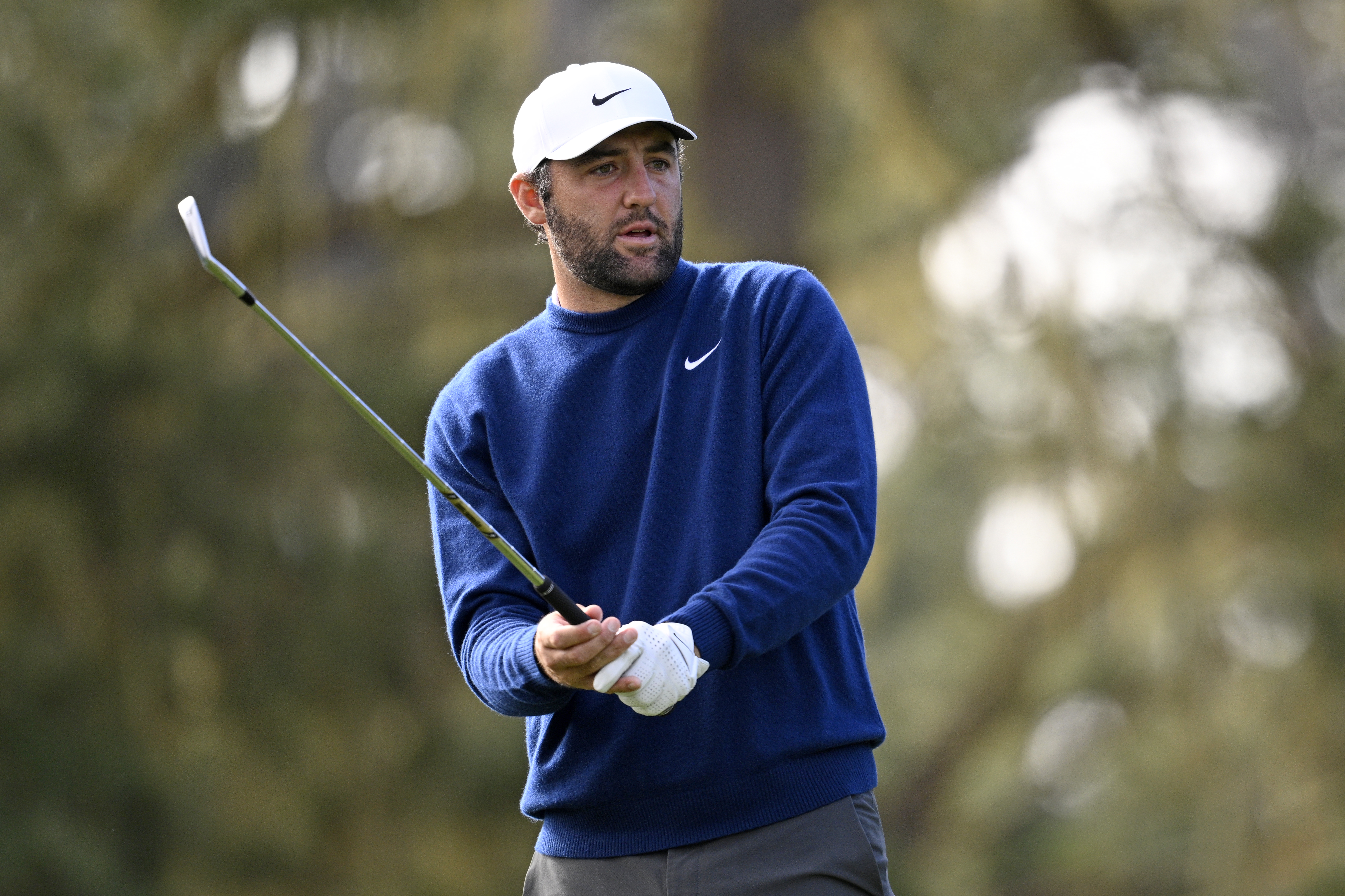 Scottie Scheffler steps into an iron shot