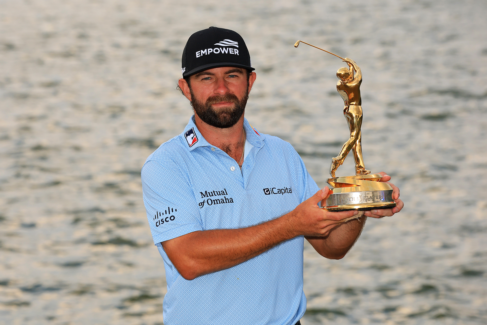Cameron Young holding the Players Championship trophy after winning at TPC Sawgrass in April 2026